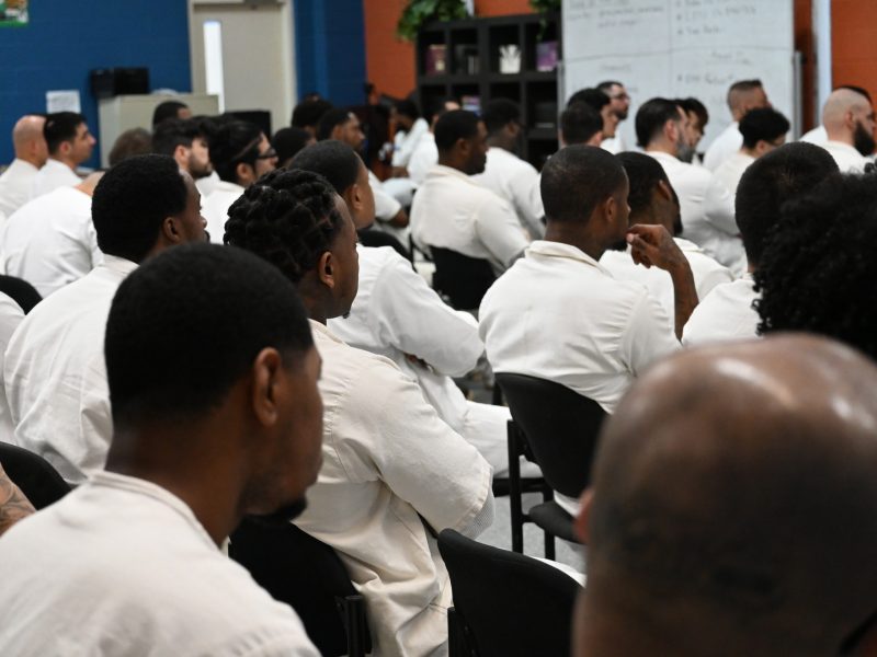 PEP participants gathered in a classroom setting, attentively listening during a program session focused on personal and professional development.