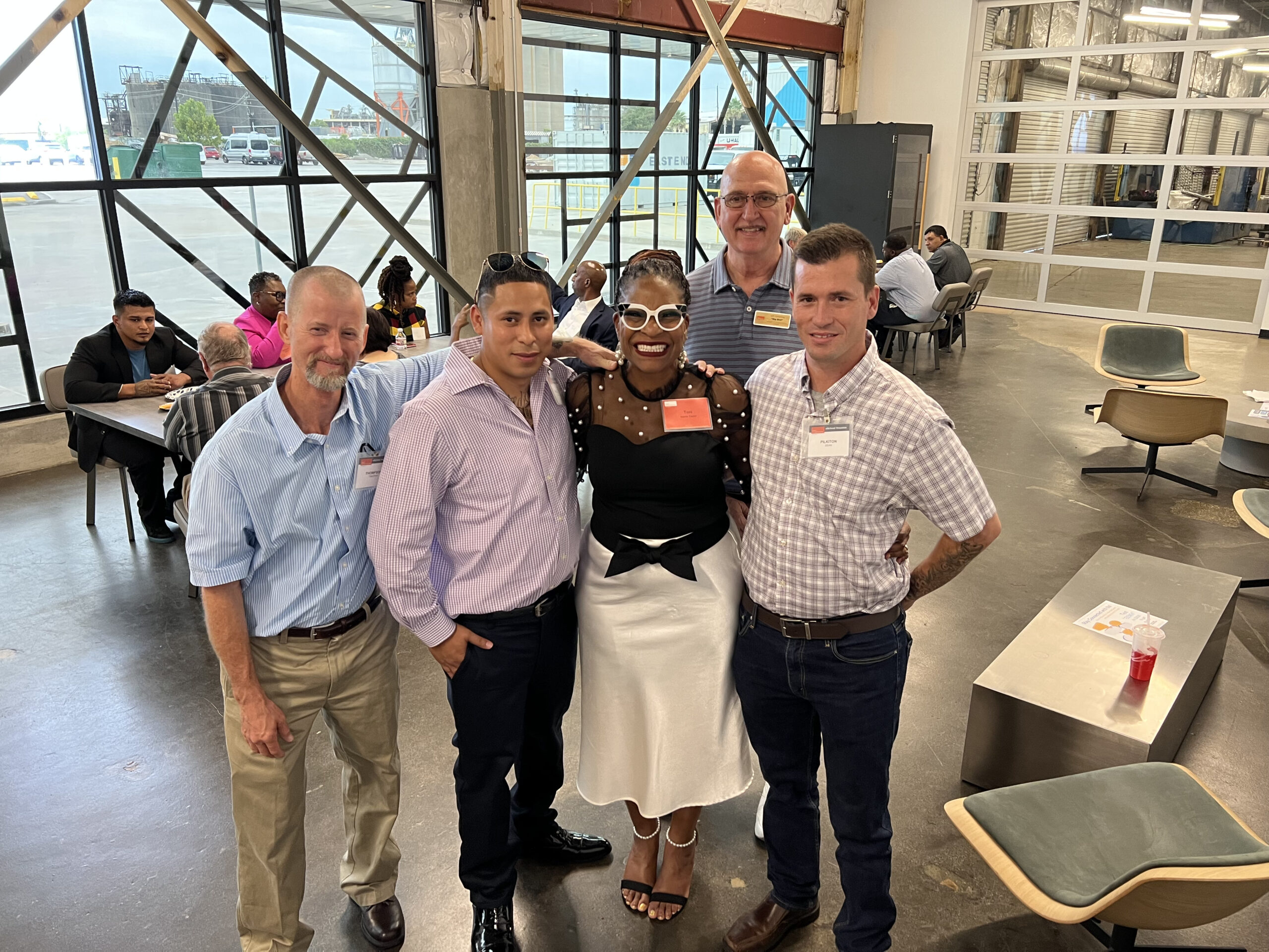 PEP graduates and supporters networking together at community event