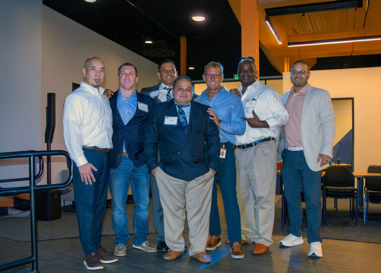 Group of PEP alumni and mentors posing together at entrepreneurship event